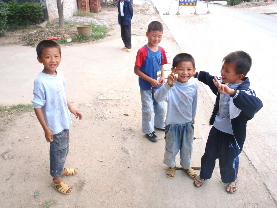 Taking pictures and showing these curious boys some of the photo images.